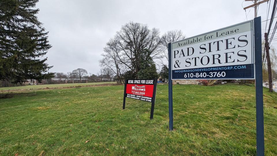 A property along Mount Zion Road leads into a field that could be developed into a Wawa with gasoline pumps, a Starbucks, restaurants, and apartments.