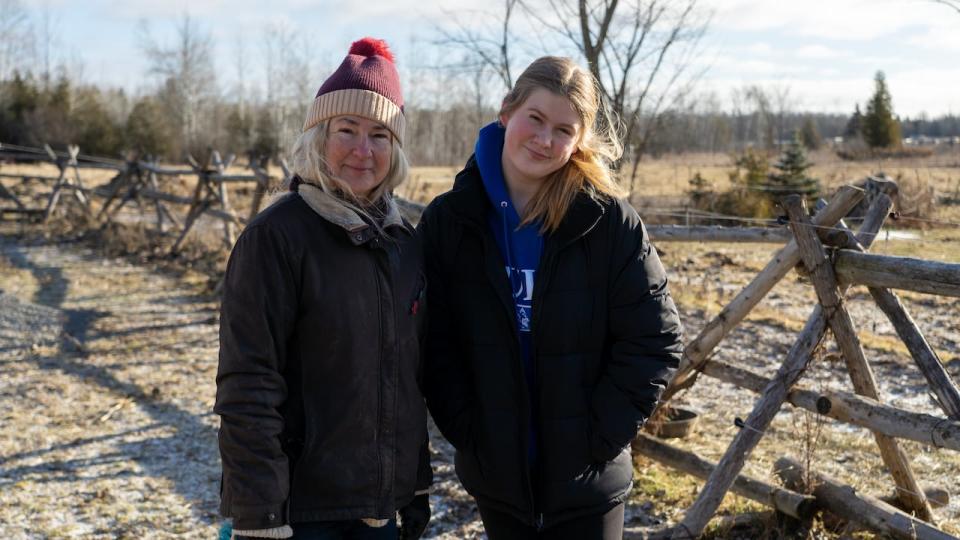 Carol Richenhaller stands next to her daughter, Bronwyn. 