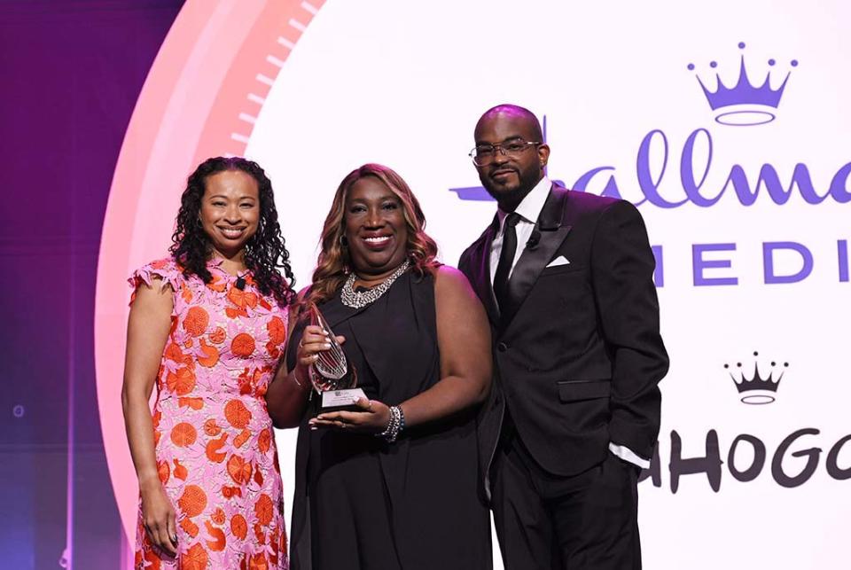 (From l.): Walter Kaitz Foundation dinner co-chairs Dalila Wilson-Scott of Comcast and Detavio Samuels of Revolt with Toni Judkins, senior VP of programming development, Hallmark Media, who accepted the ChangeMaker award for the network’s Mahogany content initiative.