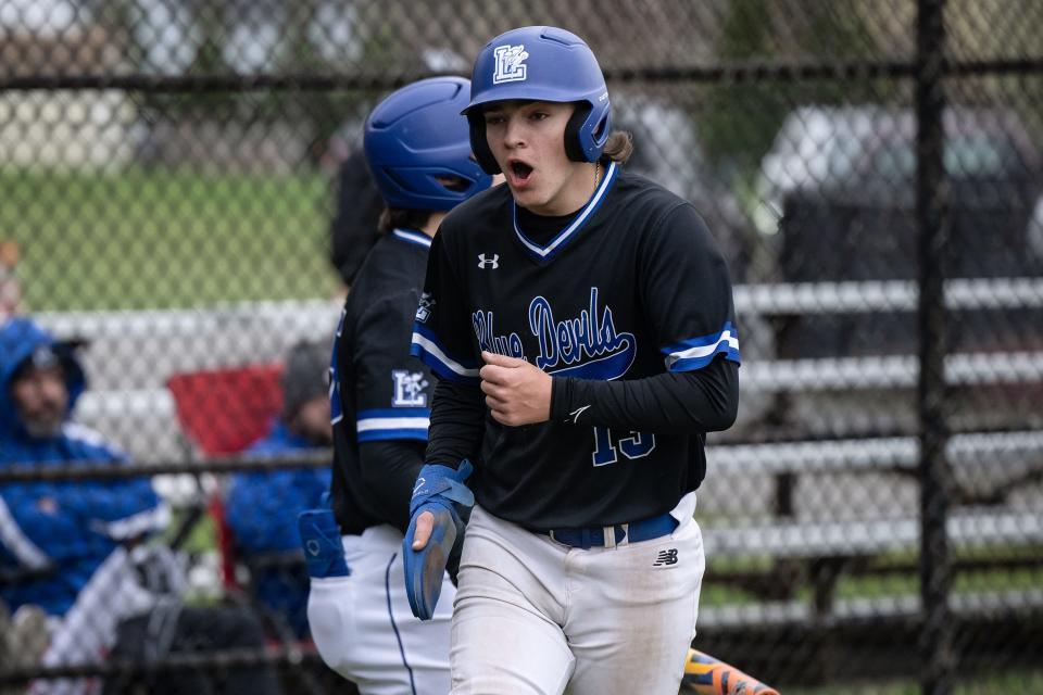 Leominster's Reece Lora celebrates after scoring in the first inning.