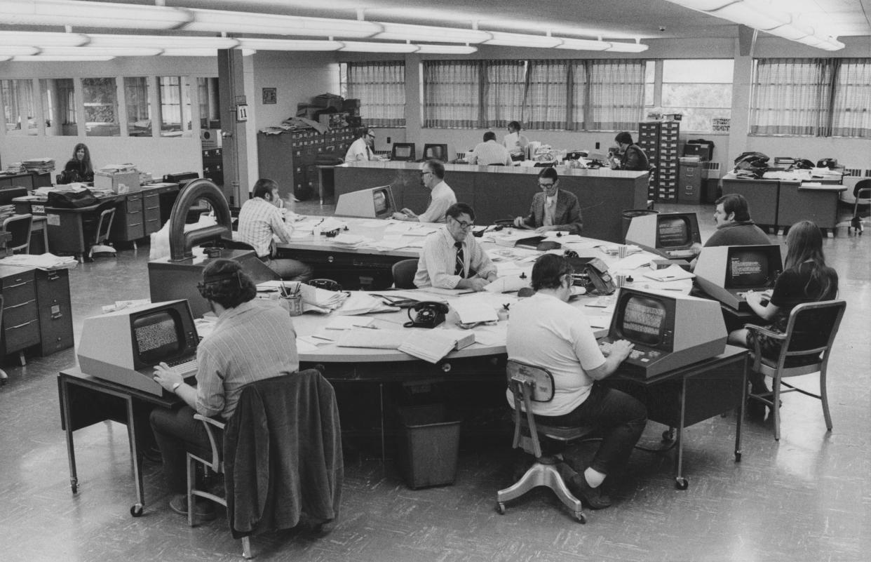 In this Journal Star photo from June 1974, copy editors and reporters work in the newspaper's computerized newsroom. At the time, the Journal Star was among a handful of the 1,700 U.S. dailies to convert from the old method of printers setting words into lead to a new system of computers setting words on paper.
