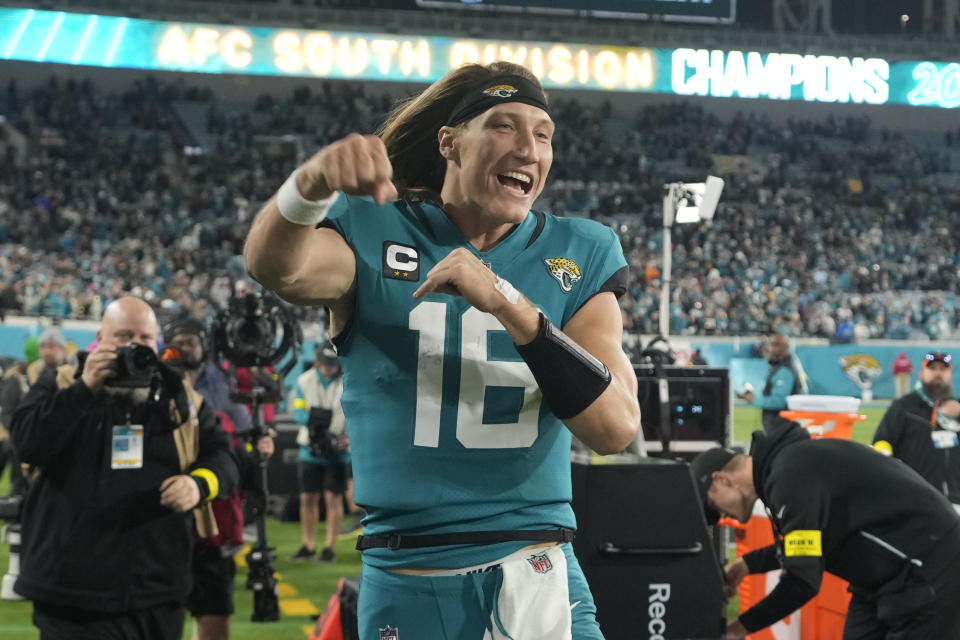 Jacksonville Jaguars quarterback Trevor Lawrence (16) celebrates after defeating the Tennessee Titans in an NFL football game, Saturday, Jan. 7, 2023, in Jacksonville, Fla. The Jaguars won 20-16. (AP Photo/John Raoux)