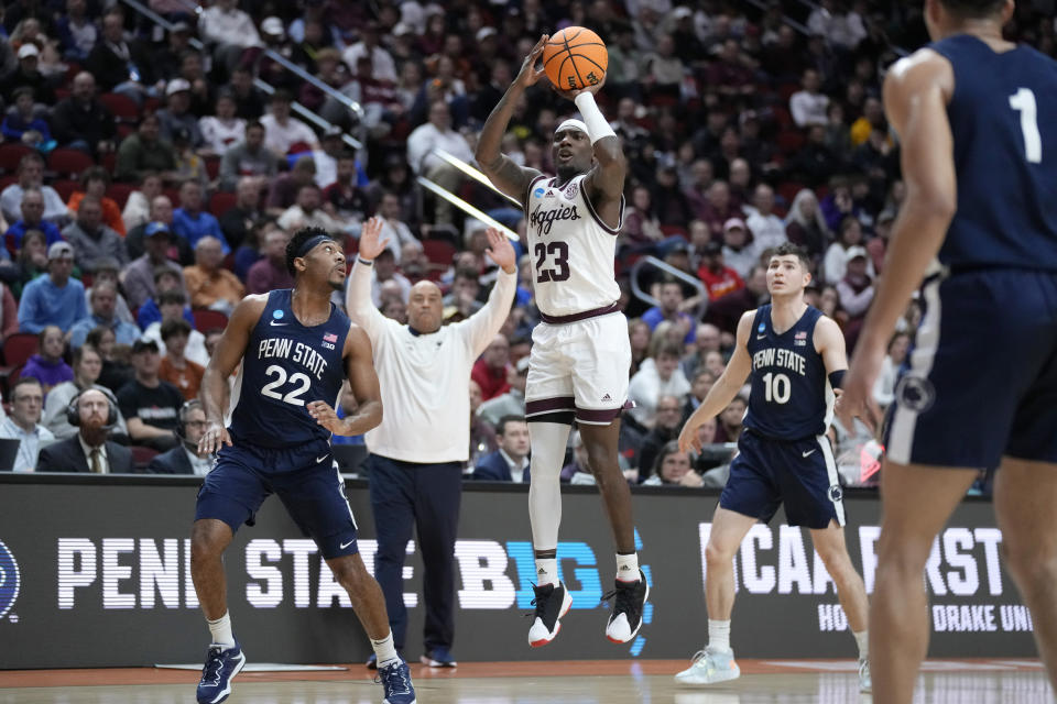 Texas A&M guard Tyrece Radford (23) shoots over Penn State guard Jalen Pickett (22) and guard Andrew Funk (10) in the first half of a first-round college basketball game in the NCAA Tournament, Thursday, March 16, 2023, in Des Moines, Iowa. (AP Photo/Charlie Neibergall)