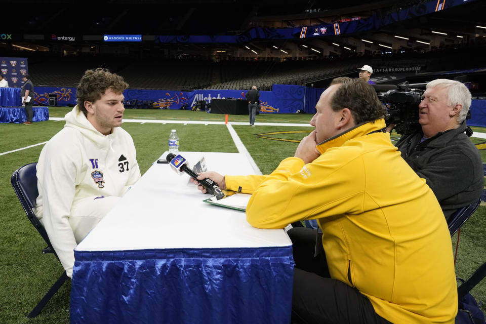 Washington tight end Jack Westover talks to reporters during media day for the the upcoming Sugar Bowl NCAA CFP college football semi-final game game in New Orleans, Saturday, Dec. 30, 2023. (AP Photo/Gerald Herbert)