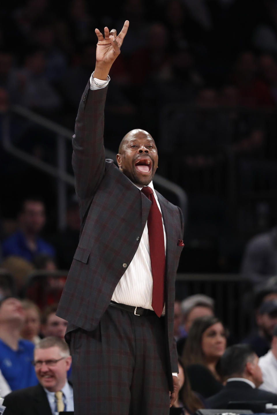 Georgetown coach Patrick Ewing gestures to his players during the second half of the team's NCAA college basketball game against St. John's in the first round of the Big East men's tournament Wednesday, March 11, 2020, in New York. (AP Photo/Kathy Willens)