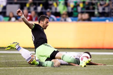 Oct 4, 2015; Seattle, WA, USA; Seattle Sounders FC defender Zach Scott (20) clears a ball against the Los Angeles Galaxy during the first half at CenturyLink Field. Los Angeles tied Seattle, 1-1. Joe Nicholson-USA TODAY Sports