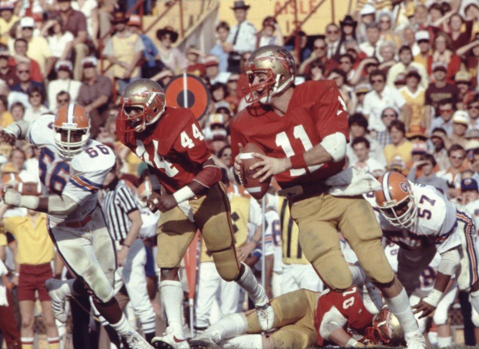 Florida State quarterback Rick Stockstill rolls out against the University of Florida.