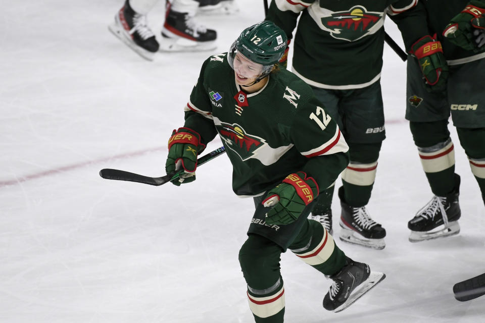 Minnesota Wild left wing Matt Boldy skates to the bench to celebrate after scoring against the Edmonton Oilers during the first period of an NHL hockey game, Monday, Dec. 12, 2022, in St. Paul, Minn. (AP Photo/Craig Lassig)