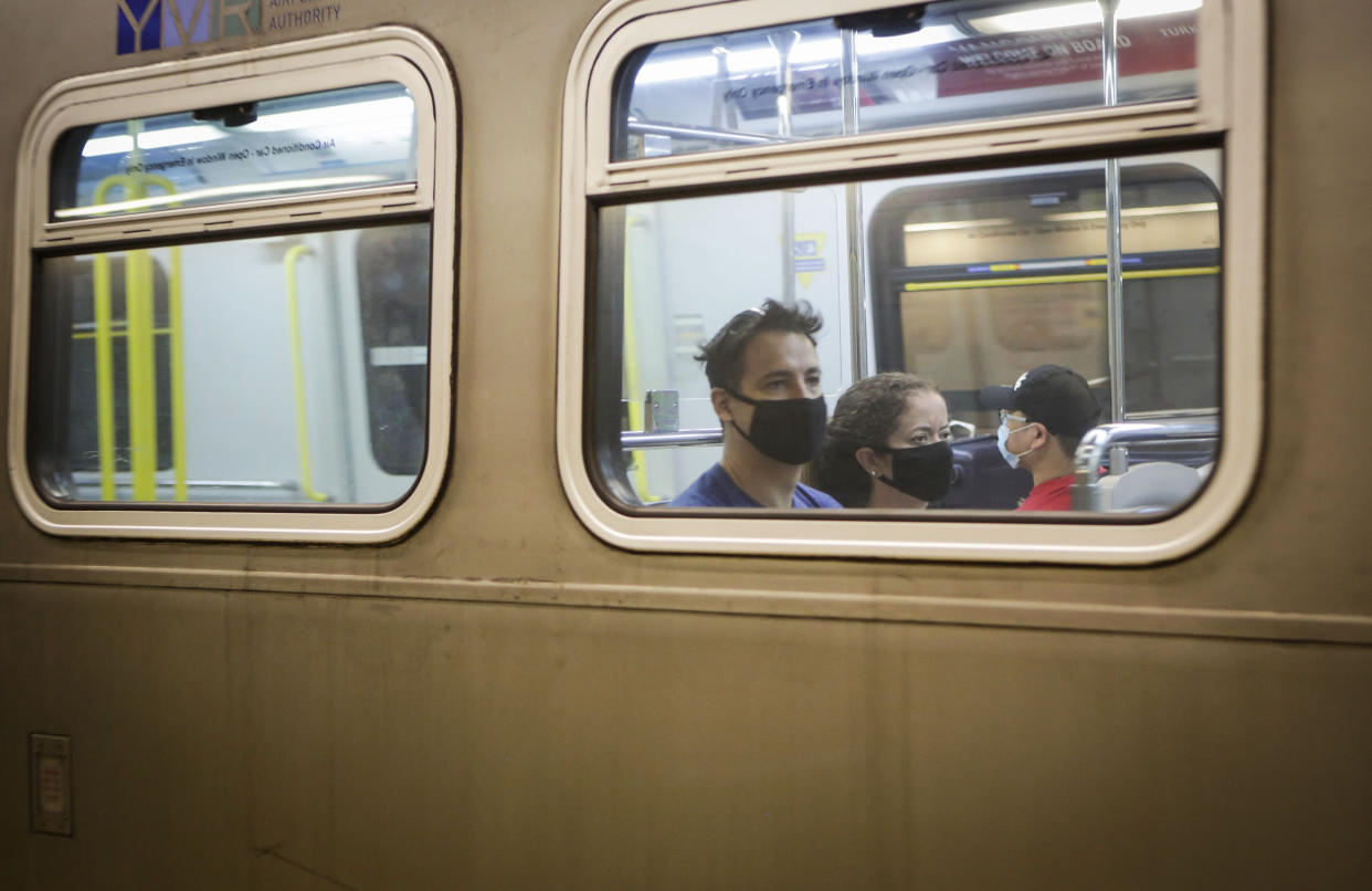 VANCOUVER, July 18, 2020 -- Passengers wearing face masks ride a SkyTrain in Vancouver, British Columbia, Canada, on July 18, 2020. As new COVID-19 cases in British Columbia continued to tick upwards, health officials urged those who can to wear a mask on transit and in other confined spaces, such as grocery stores. (Photo by Liang Sen/Xinhua via Getty) (Xinhua/Liang Sen via Getty Images)