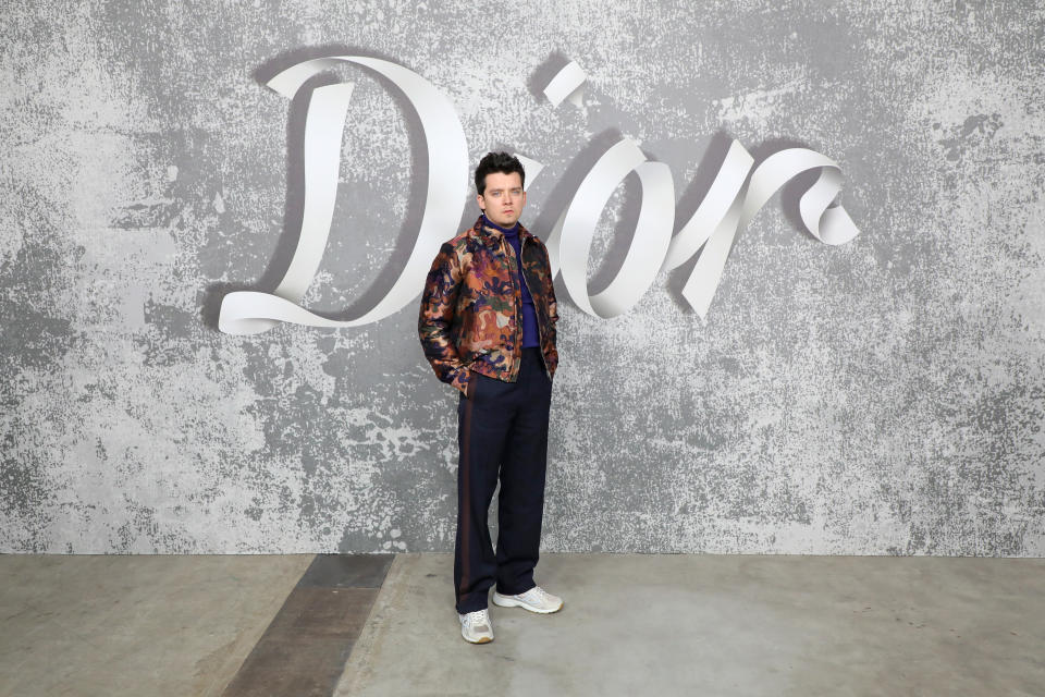 LONDON, ENGLAND - DECEMBER 08:  Asa Butterfield attends the Dior Men's Fall 2022 show at Olympia Grand on December 9, 2021 in London, England. (Photo by David M. Benett/Dave Benett/Getty Images for Dior)