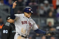 Houston Astros Jeremy Pena (3) reacts after scoring on a base hit by Alex Bregman against the New York Yankees during the seventh inning of Game 4 of an American League Championship baseball series, Sunday, Oct. 23, 2022, in New York. (AP Photo/John Minchillo)