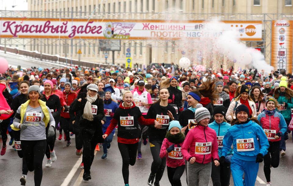 Women participate in the "Beauty Run" to mark International Women's Day.