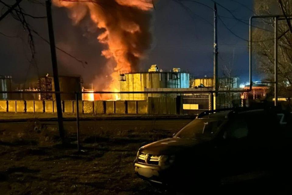 A fuel tank in occupied Luhansk, eastern Ukraine, is seen on fire overnight after an alleged UAV strike (Telegram)