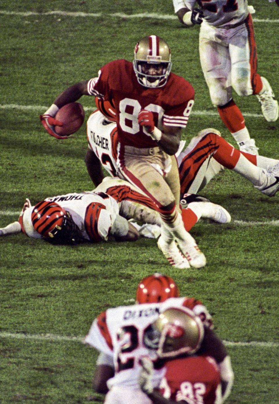 San Francisco 49ers wide receiver Jerry Rice (80) carries the ball against the Cincinnati Bengals during Super Bowl XXIII at Joe Robbie Stadium in Miami, Florida. The 49ers defeated the Bengals 20-16. Tim Dillon/USA TODAY NETWORK