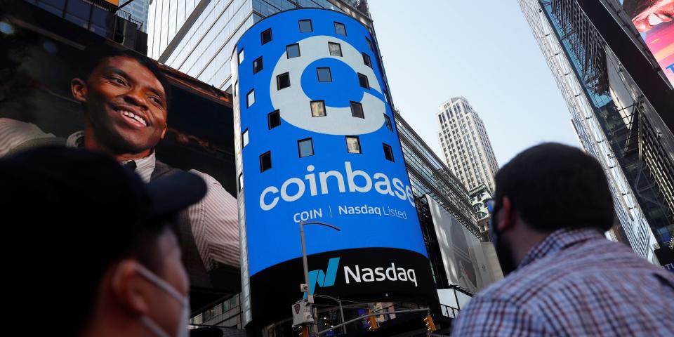 People watch from Times Square on the day Coinbase made its public trading debut on the Nasdaq in April.