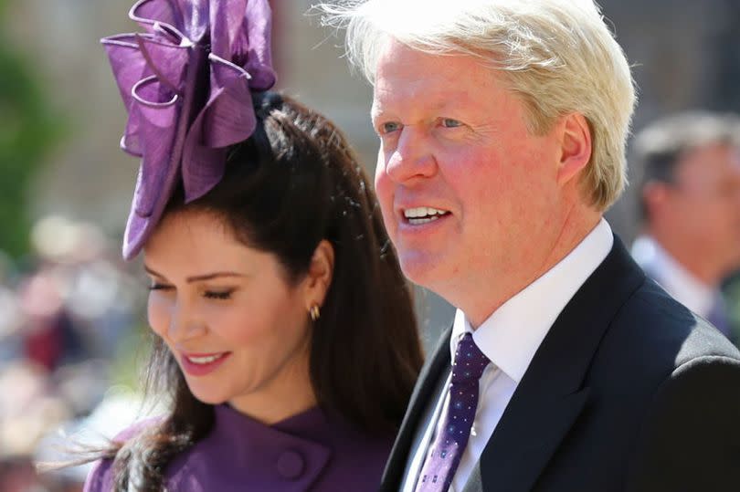 Prince Harry's Uncle Charles Spencer (R) and Karen Spencer leave after attending the wedding ceremony of Britain's Prince Harry, Duke of Sussex and US actress Meghan Markle at St George's Chapel, Windsor Castle, in Windsor, on May 19, 2018.