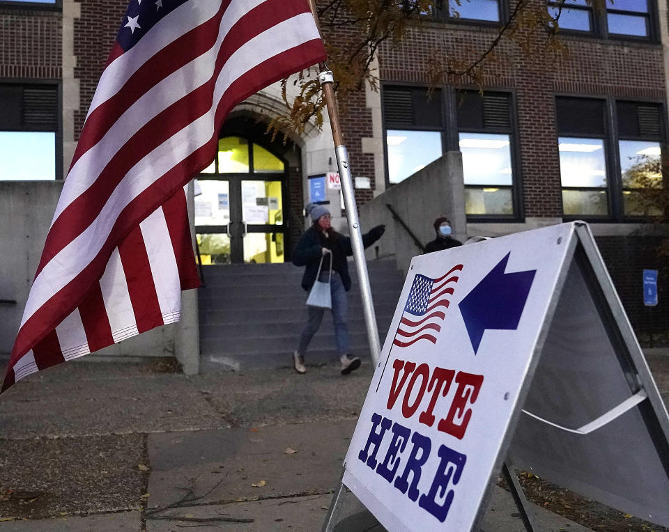 Voters emerge from Sabathani Community Center after casting their ballots during municipal elections Tuesday, Nov. 2, 2021, in Minneapolis. Voters in Minneapolis are deciding whether to replace the city’s police department with a new Department of Public Safety. The election comes more than a year after George Floyd’s death launched a movement to defund or abolish police across the country.(David Joles /Star Tribune via AP)