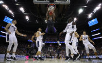 <p>Noah Dickerson #15 of the Washington Huskies dunks against Abel Porter #15 and Neemias Queta #23 of the Utah State Aggies during the first half of the game in the first round of the 2019 NCAA Men’s Basketball Tournament at Nationwide Arena on March 22, 2019 in Columbus, Ohio. </p>