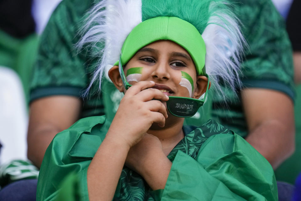 A Saudi Arabian's fan waits for the World Cup group C soccer match between Poland and Saudi Arabia, at the Education City Stadium in Al Rayyan , Qatar, Saturday, Nov. 26, 2022. (AP Photo/Manu Fernandez)