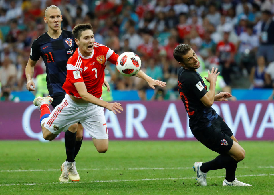 <p>Croatia’s Domagoj Vida in action with Russia’s Daler Kuzyayev </p>