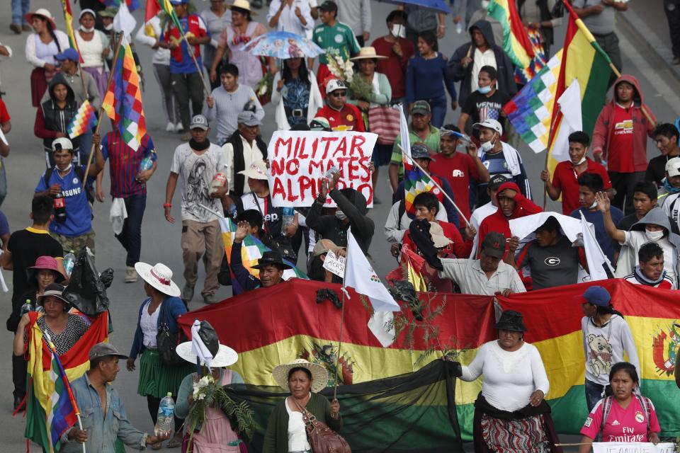 Coca leaf producers, supporters of former President Evo Morales march to Cochabamba from Sacaba, Bolivia, Saturday, Nov. 16, 2019. Officials now say at least eight people died when Bolivian security forces fired on Morales supporters the day before, in Sacaba. The U.N. human rights chief says she’s worried that Bolivia could “spin out of control” as the interim government tries to restore stability following the resignation of the former president in an election dispute. (AP Photo/Juan Karita)