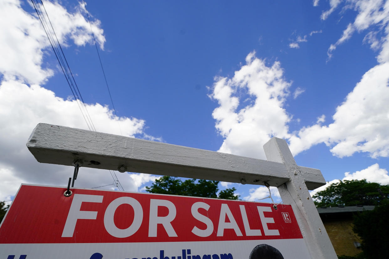 'For Sale' sign is pictured in the front yard of a house in Toronto, Ontario, Canada, July 17, 2018. Picture taken July 17, 2018. REUTERS/Carlo Allegri