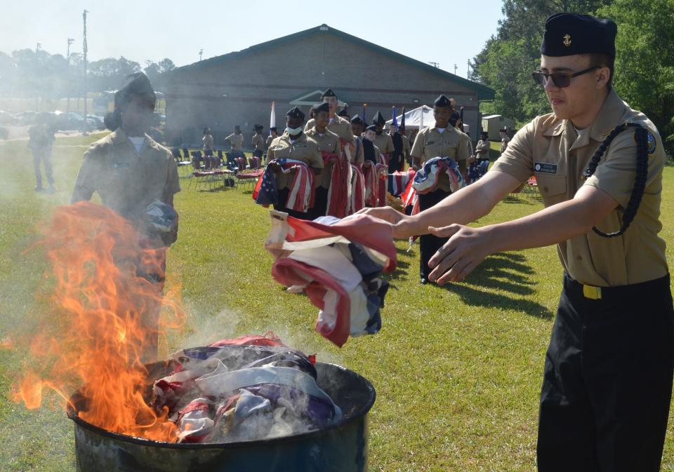 More than 150 worn and faded flags were retired during the ceremony held by Jefferson County's NJROTC.