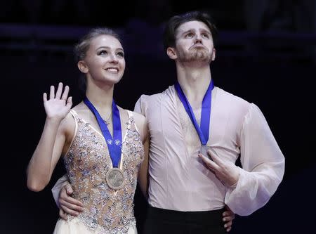 Figure Skating - ISU European Championships 2018 - Ice Dance Victory Ceremony - Moscow, Russia - January 20, 2018 - Bronze medallists Alexandra Stepanova and Ivan Bukin of Russia attend the ceremony. REUTERS/Grigory Dukor
