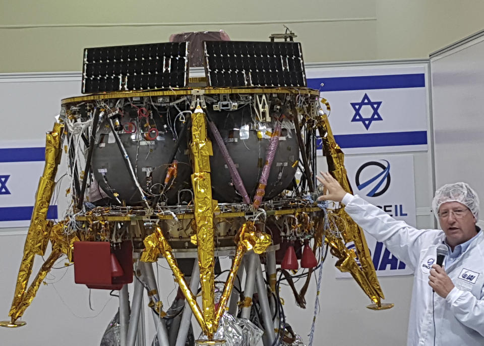 FILE - In this July 10, 2018 file photo, Opher Doron, general manager of Israel Aerospace Industries' space division, speaks beside the SpaceIL lunar module, during a press tour of their facility near Tel Aviv, Israel. On Thursday April 4, 2019, the first Israeli spacecraft to journey to the moon passed its most crucial test yet: dropping into lunar orbit one week ahead of landing. (AP Photo/Ilan Ben Zion, File)