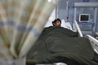 A Nepalese Sherpa Dawa Tashi, who was injured during an avalanche gets treatment at a hospital in Katmandu, Nepal, Friday, April 18, 2014. An avalanche swept down a climbing route on Mount Everest early Friday, killing at least 12 Nepalese guides and leaving three missing in the deadliest disaster on the world's highest peak. (AP Photo/Niranjan Shrestha)