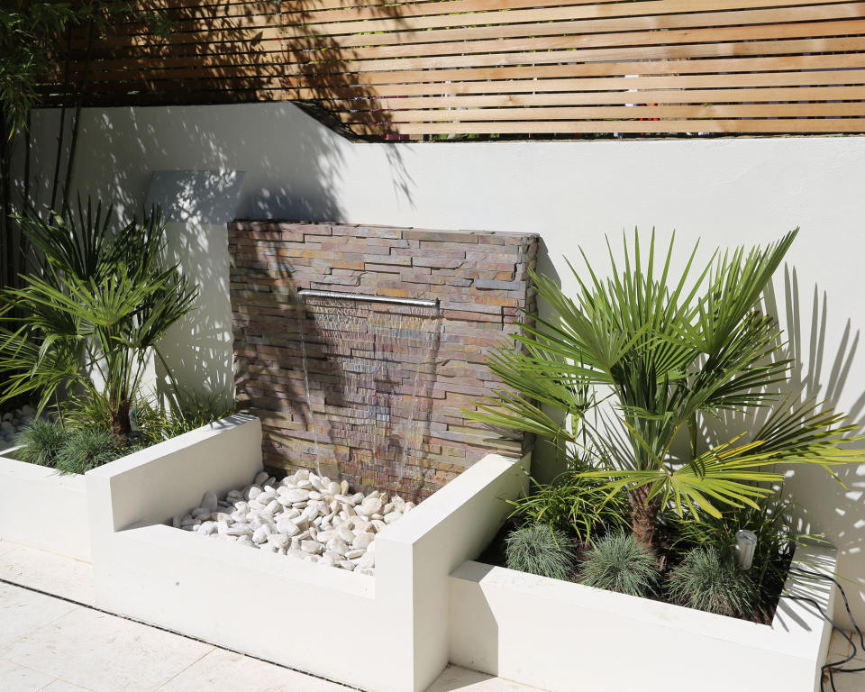 6. Highlight falling water with a stone feature wall