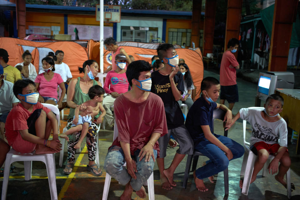 CALOOCAN, PHILIPPINES - APRIL 28 Homeless children whom Fr Pon saved in the streets earlier to be brought in a government shelter on April 28, 2020 in Caloocan, Philippines. Armed with a cross and a holy bible and clad in a makeshift hazmat suit and face shields, Fr Eduardo Pon Vasquez, a Roman Catholic priest for 17 years of the Oblates of Mary Immaculate, visits the poorer communities in Caloocan city to make sure marginalized residents and homeless are cared for during a government imposed lockdown to prevent the spread of the novel Coronavirus. Together with Fr Rey Emmanuelle Amancio, 31, they provide food, masks, and words of comfort to those in need in their community. If the people cannot come out to go to church at this very precarious times, the church should come to them, say Fr Pon. (Photo by Jes Aznar/Getty Images)