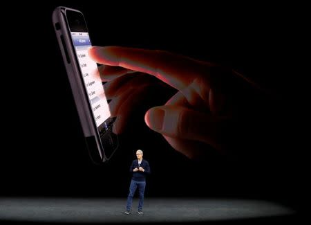 FILE PHOTO: Tim Cook, CEO of Apple, introduces the iPhone 8 during a launch event in Cupertino, California, U.S. September 12, 2017. REUTERS/Stephen Lam/File Photo