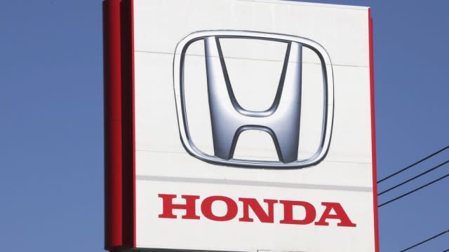 The sign of a Honda dealership is shown.