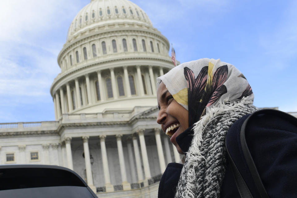 Rep.-elect Ilhan Omar, D-Minn., smiles during an interview following a photo opportunity on Capitol Hill in Washington, Wednesday, Nov. 14, 2018, with the freshman class. (AP Photo/Susan Walsh)
