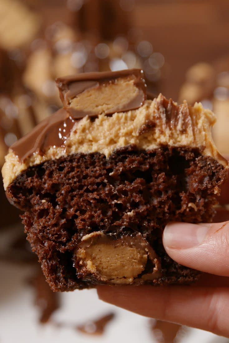 <p>Save some mini Reese's from candy bowl fate and put 'em in cupcakes instead.</p><p>Get the recipe from <a href="https://www.delish.com/cooking/recipe-ideas/recipes/a51268/reeses-stuffed-cupcakes-recipe/" rel="nofollow noopener" target="_blank" data-ylk="slk:Delish;elm:context_link;itc:0;sec:content-canvas" class="link ">Delish</a>.</p>