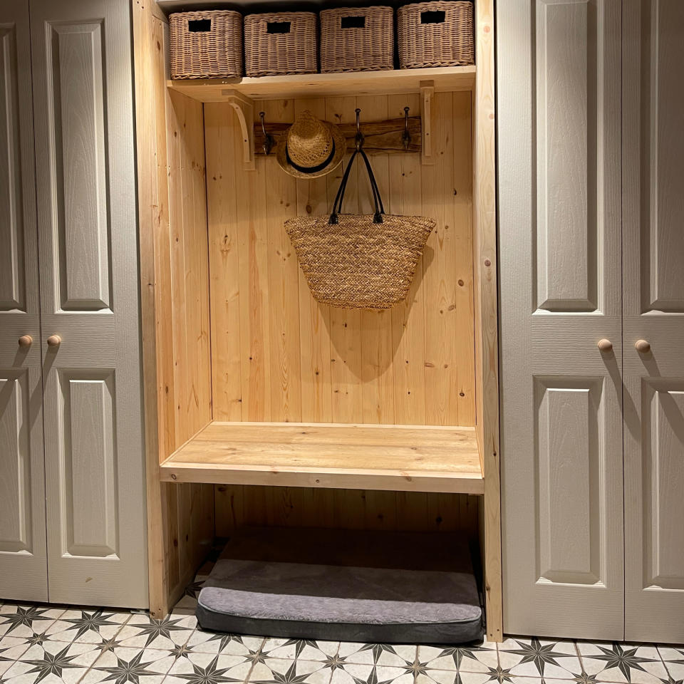 hallway storage with fitted furniture and hooks