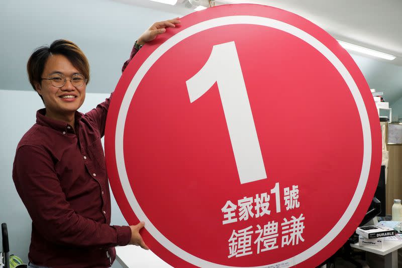 Johnny Chung, a 29-year-old pro-democracy district councillor, poses in his office ahead of the upcoming district council election in Hong Kong