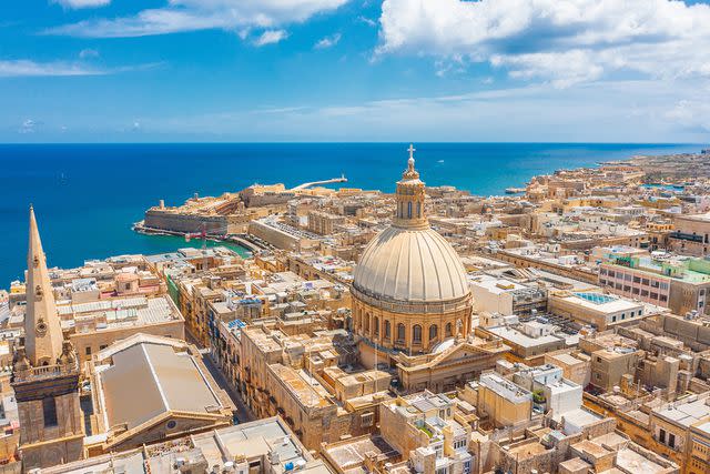 <p>Getty</p> Lady of Mount Carmel Church and St. Paul's Cathedral in Valletta, Malta