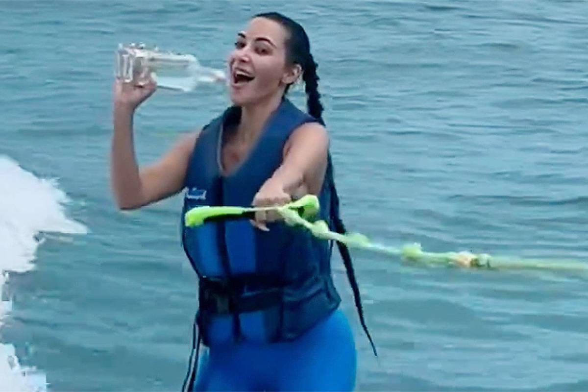 Kim Kardashian Wipes Out Wakeboarding But Saves the Bottle of