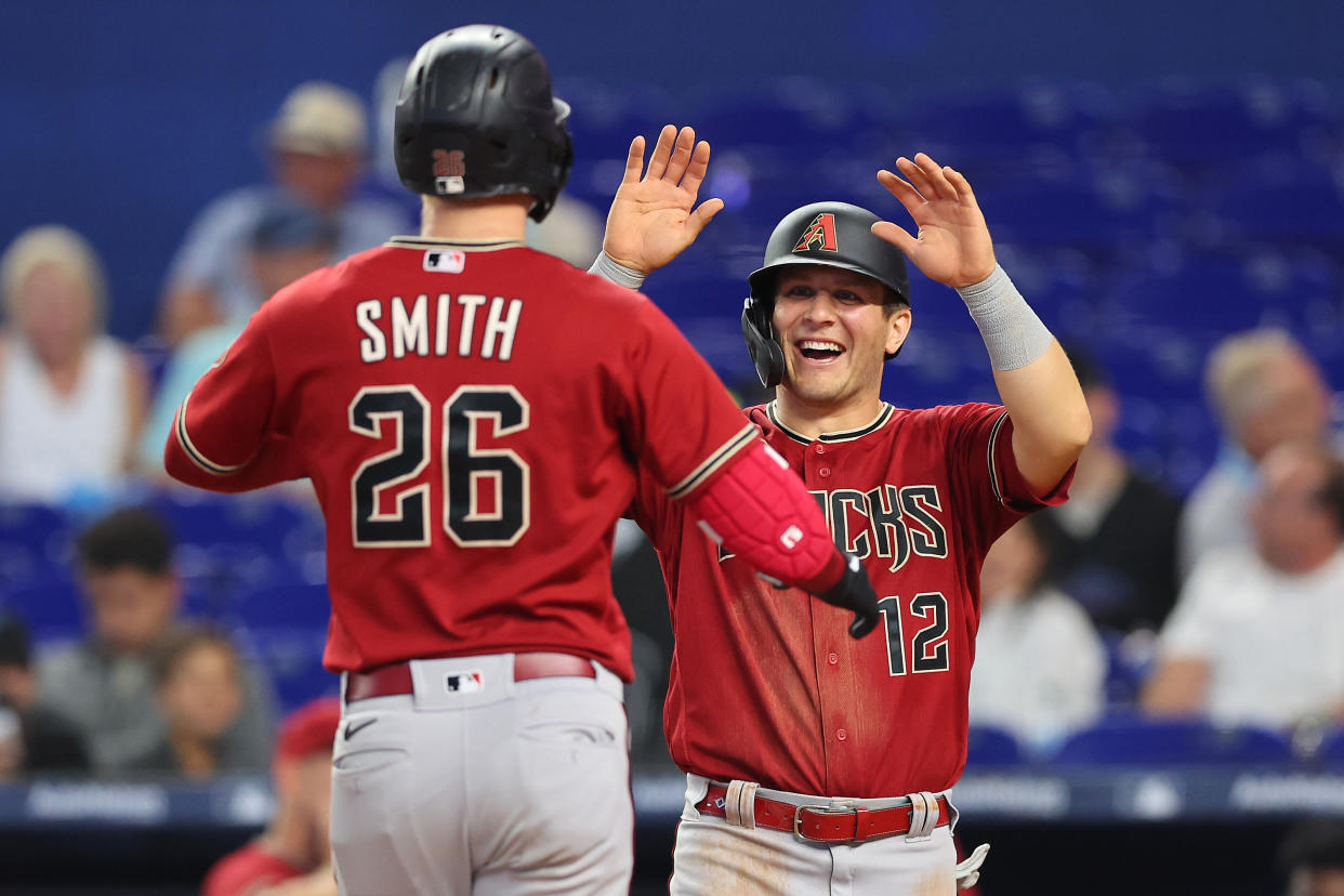Pavin Smith of the Arizona Diamondbacks celebrates with Daulton Varsho after a home run. (Photo by Michael Reaves/Getty Images)