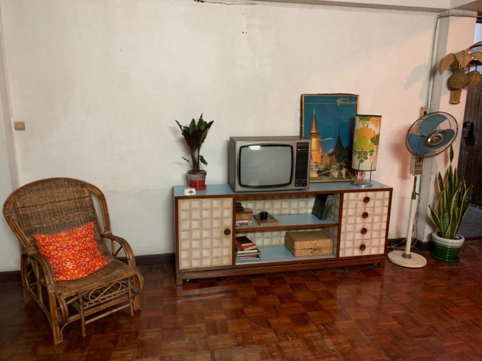 1970s furniture in a Bangkok apartment styled for the eight-episode series. “I have a special relationship to the 1970s—this decade is my favorite,” says production designer François-Renaud Labarthe.