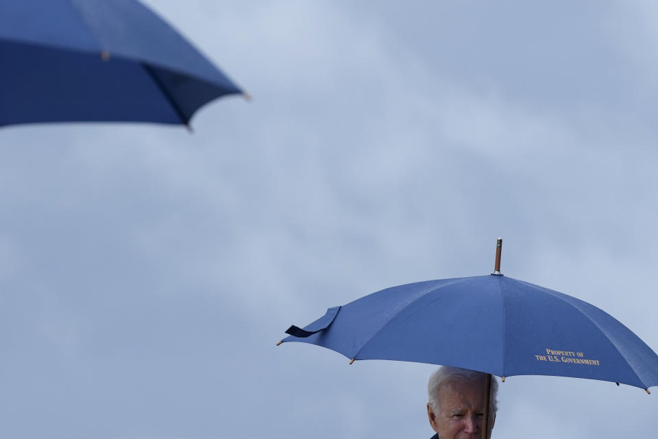 President Joe Biden carries an umbrella as he boards Air Force One in the rain, Monday, May 29, 2023, at Andrews Air Force Base, Md. Biden is en route to New Castle, Del. (AP Photo/Patrick Semansky)