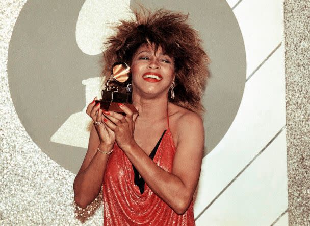 PHOTO: Tina Turner holds up a Grammy Award, Feb. 27, 1985, in Los Angeles. (Nick Ut/AP)