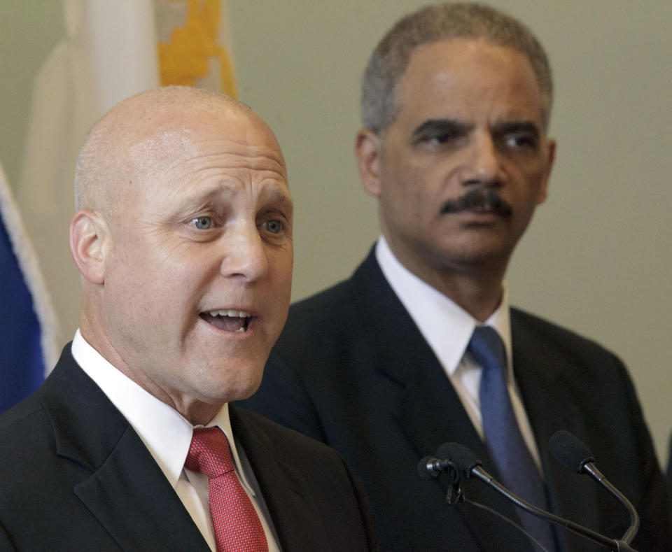 New Orleans Mayor Mitch Landrieu speaks next to U.S. Attorney General Eric Holder about the details of a federal consent decree from the U.S. Department of Justice that will be used to institute reforms in the New Orleans Police Department inside the historic Gallier Hall, the former New Orleans city hall, in New Orleans, Tuesday, July 24, 2012. (AP Photo/Matthew Hinton)