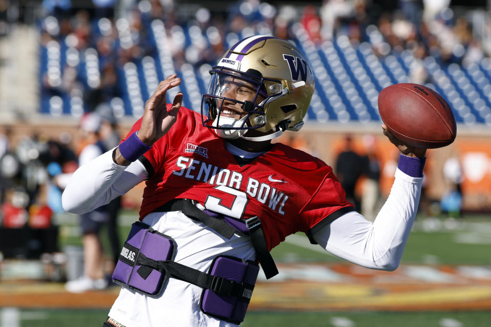 National quarterback Michael Penix Jr. of Washington throws a pass during practice for the Senior Bowl NCAA college football game, Wednesday, Jan. 31, 2024, in Mobile, Ala. (AP Photo/Butch Dill)