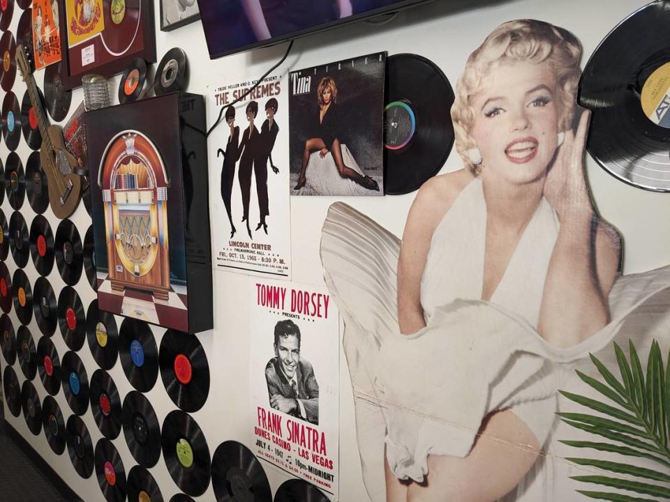 The back wall at The Sugar Shack Café is covered with vinyl records, music posters and Marilyn Monroe.