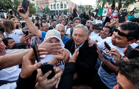 Mexican politician Andres Manuel Lopez Obrador, (C), leader of the National Regeneration Movement (MORENA) party greets supporters as he arrives for a meeting at Plaza Olivera in Los Angeles, California, U.S., February 12, 2017. REUTERS/Ringo Chiu