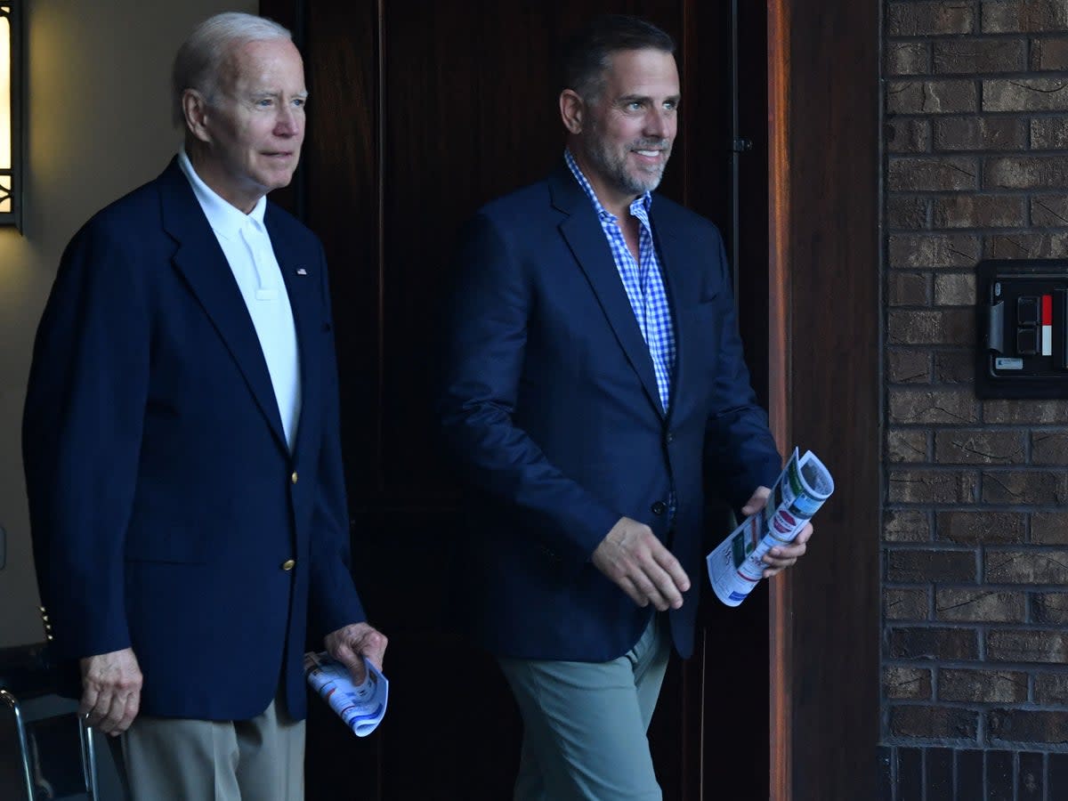 President Joe Biden and his son Hunter Biden exit Holy Spirit Catholic Church after attending mass in Johns Island, South Carolina on 13 August 2022 (NICHOLAS KAMM/AFP via Getty Images)