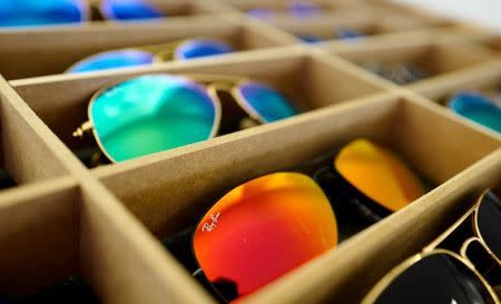 FILE PHOTO: Sunglasses from Ray Ban, a Luxottica owned brand, are on display at an optician shop in Hanau, Germany, March 18, 2016. REUTERS/Kai Pfaffenbach/File Photo